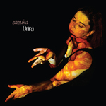 Dancing artist lit by red and yellow stripes of light against a black backdrop